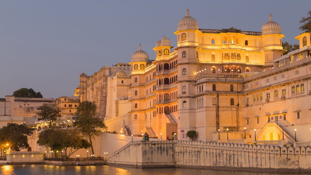 City Palace illuminated along the lake in Udaipur, Rajasthan